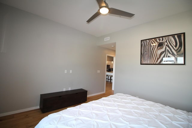 bedroom featuring ceiling fan and hardwood / wood-style floors