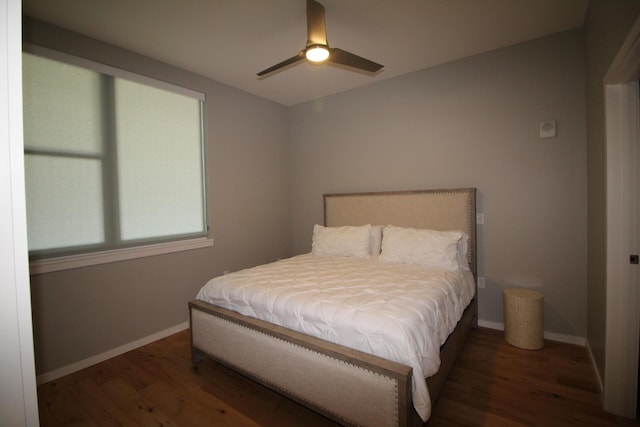 bedroom featuring ceiling fan and dark wood-type flooring