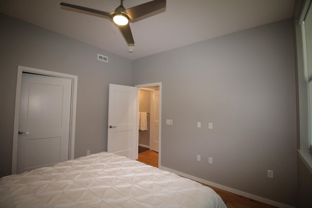 bedroom featuring hardwood / wood-style floors and ceiling fan