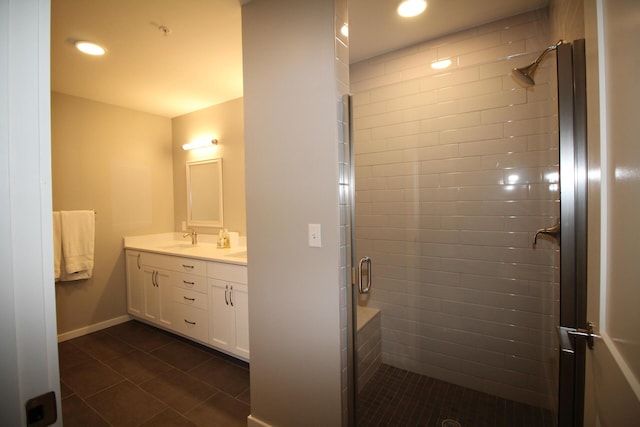 bathroom featuring tile patterned flooring, vanity, and an enclosed shower