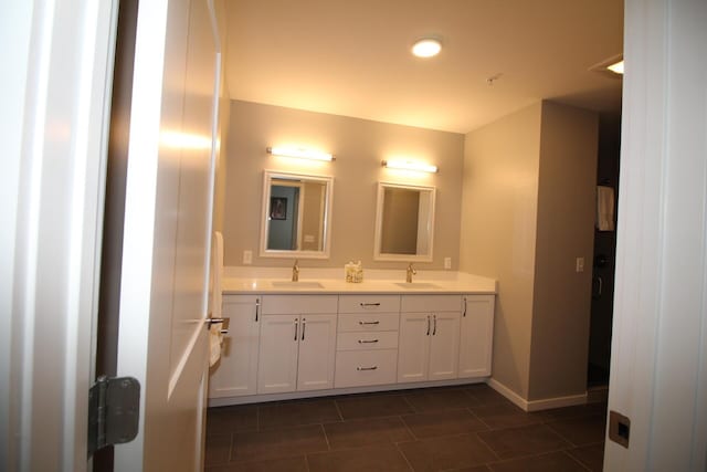 bathroom with tile patterned flooring and vanity