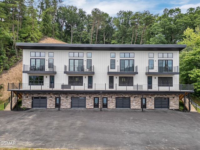 3141 Teaster Ln Unit 2, Pigeon Forge, TN 37863 - view of front of home with stairway, an attached garage, and driveway