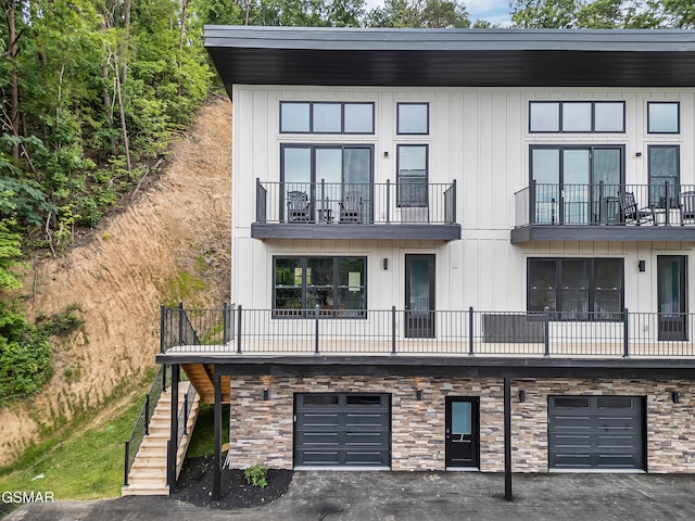 3141 Teaster Ln Unit 2, Pigeon Forge, TN 37863 - view of property with a garage, stairs, and driveway