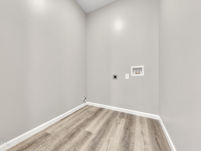3141 Teaster Ln Unit 2, Pigeon Forge, TN 37863 - laundry room with electric dryer hookup, wood finished floors, and hookup for a washing machine