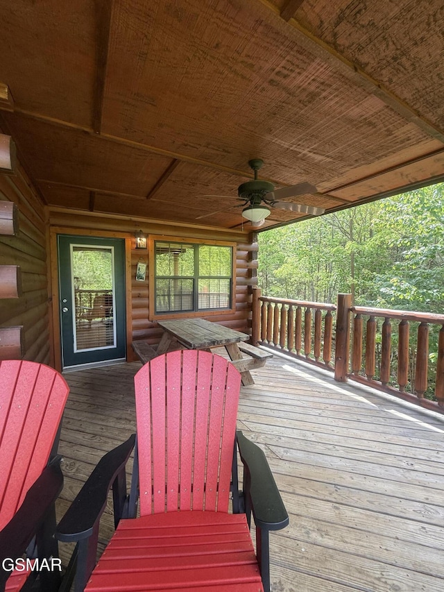 wooden deck with a ceiling fan