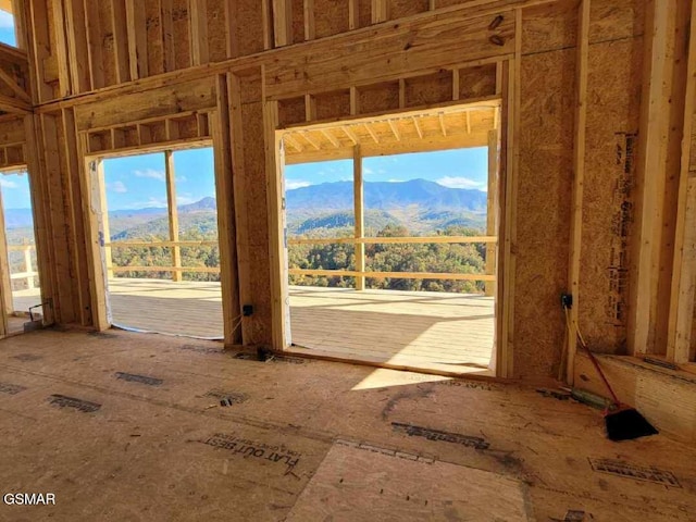 miscellaneous room with a mountain view