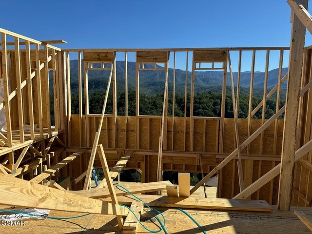 miscellaneous room with a mountain view