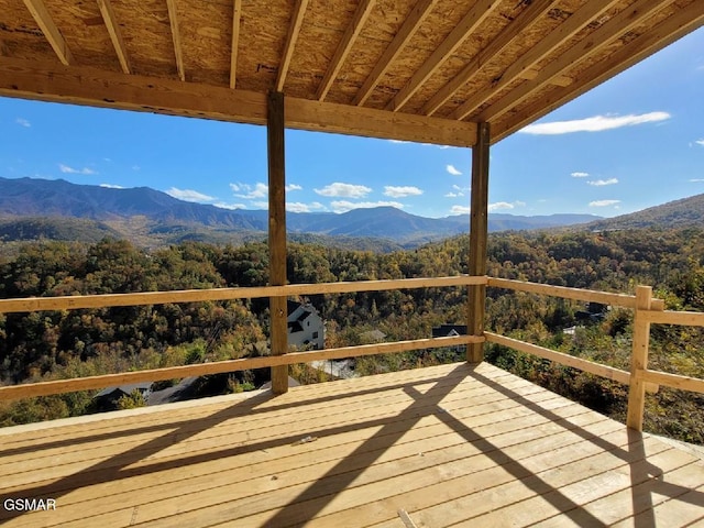 wooden terrace featuring a mountain view