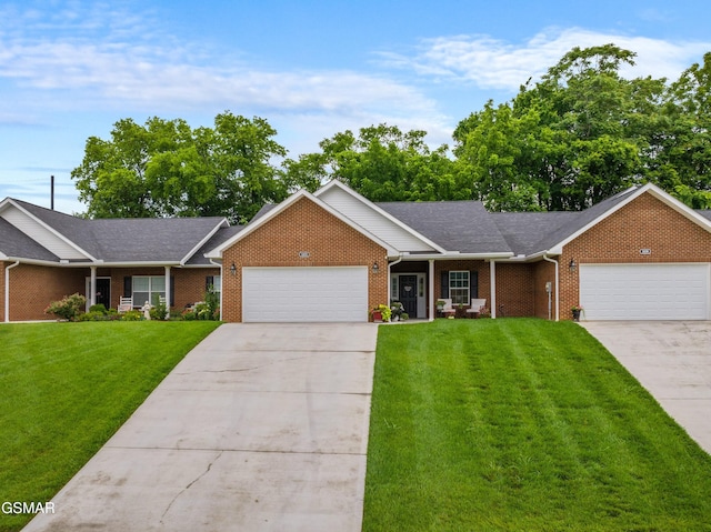 1032 Patriots Dr, Dandridge, TN 37725 - single story home featuring a garage, concrete driveway, and a front yard
