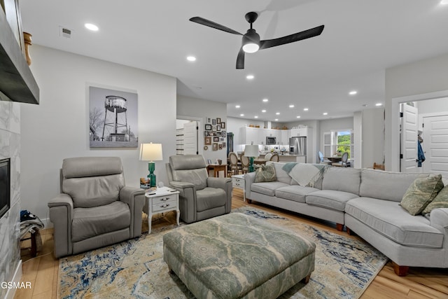 1032 Patriots Dr, Dandridge, TN 37725 - living room with a ceiling fan, light wood-style floors, recessed lighting, and a fireplace