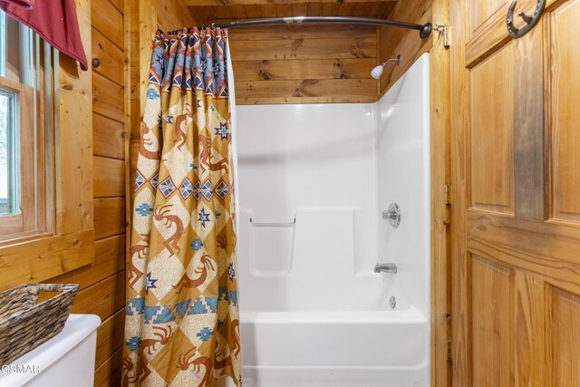 1814 Rhododendron Ln, Sevierville, TN 37876 - bathroom featuring shower / tub combo, toilet, and wood walls