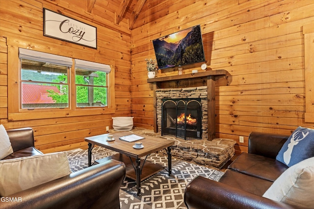 308 Brown Wren Way, Gatlinburg, TN 37738 - living area with a stone fireplace, wooden walls, and lofted ceiling