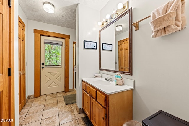 308 Brown Wren Way, Gatlinburg, TN 37738 - bathroom featuring vanity and a textured ceiling