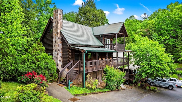 308 Brown Wren Way, Gatlinburg, TN 37738 - view of front of house featuring a chimney, a metal roof, stairway, and log exterior
