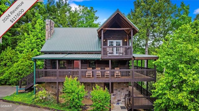 308 Brown Wren Way, Gatlinburg, TN 37738 - cabin with stairway, a chimney, a metal roof, log siding, and a deck