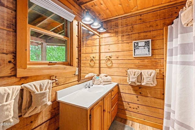 308 Brown Wren Way, Gatlinburg, TN 37738 - bathroom with wood walls, vanity, wood ceiling, and wood finished floors