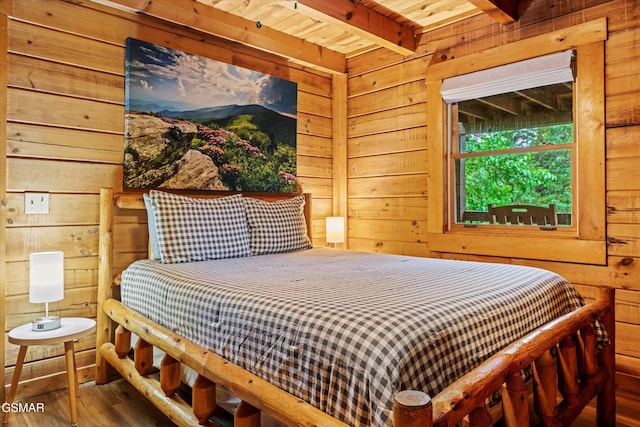 308 Brown Wren Way, Gatlinburg, TN 37738 - bedroom with wooden walls, wood finished floors, and a wooden ceiling with exposed beams