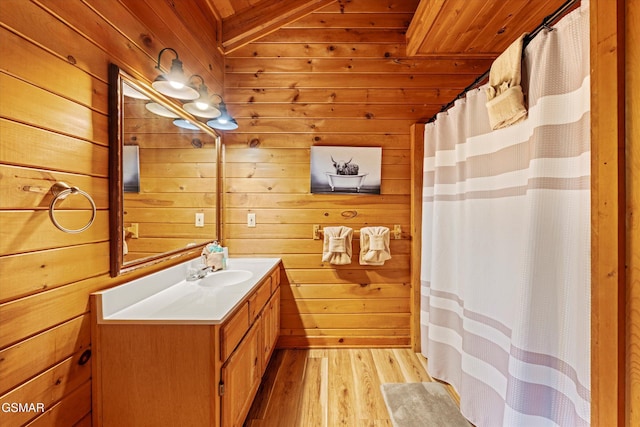 308 Brown Wren Way, Gatlinburg, TN 37738 - full bathroom with wooden ceiling, vanity, wooden walls, wood finished floors, and a shower with shower curtain