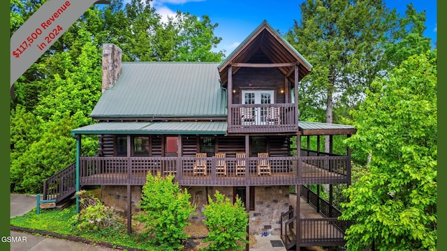 308 Brown Wren Way, Gatlinburg, TN 37738 - log-style house featuring a metal roof, stairway, a chimney, log siding, and a wooden deck