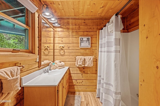 308 Brown Wren Way, Gatlinburg, TN 37738 - bathroom with wood walls, wooden ceiling, vanity, a shower with shower curtain, and wood finished floors