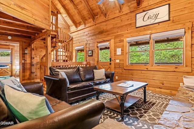 308 Brown Wren Way, Gatlinburg, TN 37738 - living room with stairs, wood walls, a wood ceiling with exposed beams, ceiling fan, and high vaulted ceiling