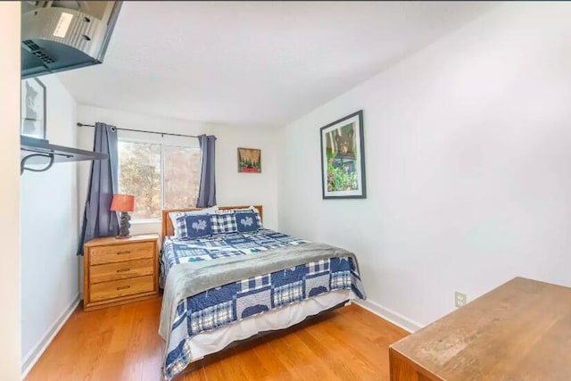 bedroom with light wood-type flooring