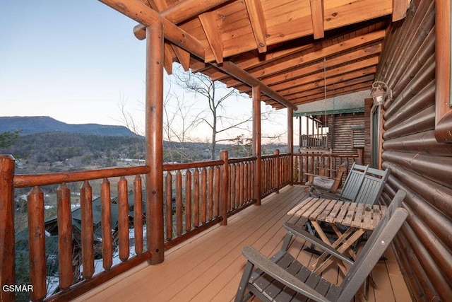 deck at dusk with a mountain view