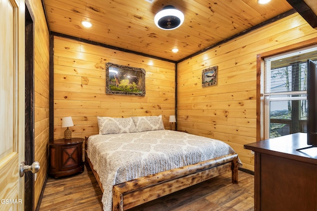 bedroom featuring wood walls, wood-type flooring, and wooden ceiling