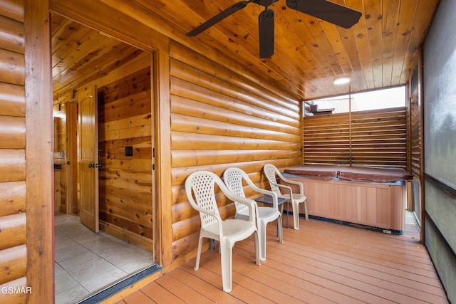 wooden deck with a hot tub