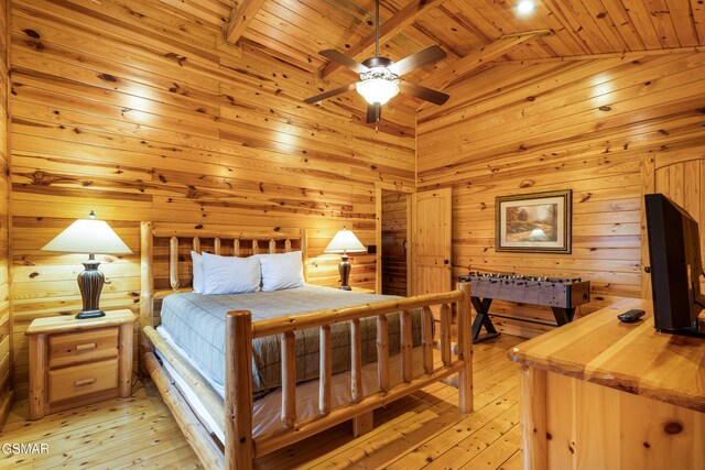 bedroom featuring ceiling fan, wood ceiling, vaulted ceiling, and light hardwood / wood-style floors