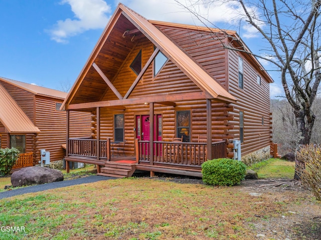 cabin featuring a porch