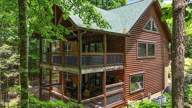2313 Bogle Spring Loop, Sevierville, TN 37862 - view of property exterior with log veneer siding and roof with shingles