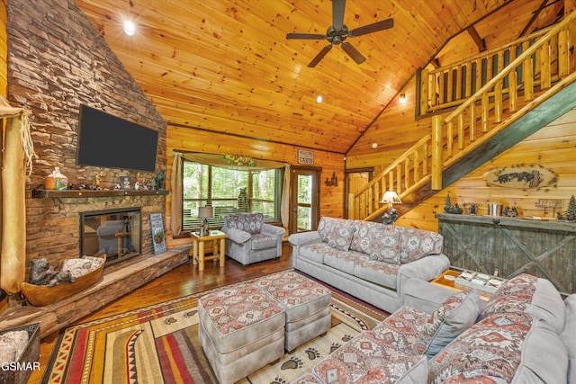2313 Bogle Spring Loop, Sevierville, TN 37862 - living area with wooden ceiling, wood-type flooring, stairway, high vaulted ceiling, and a fireplace