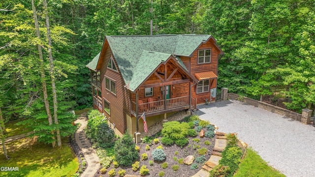 2313 Bogle Spring Loop, Sevierville, TN 37862 - chalet / cabin featuring driveway, a shingled roof, and a wooded view