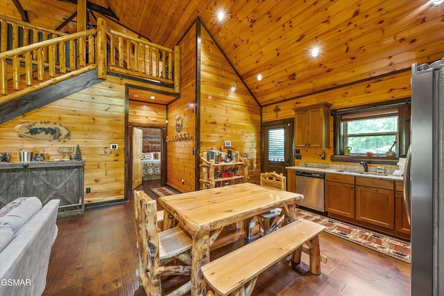 2313 Bogle Spring Loop, Sevierville, TN 37862 - dining area with wood ceiling, dark wood-style flooring, wood walls, and recessed lighting