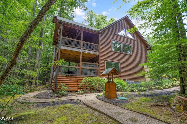 2313 Bogle Spring Loop, Sevierville, TN 37862 - rear view of house featuring faux log siding and a balcony