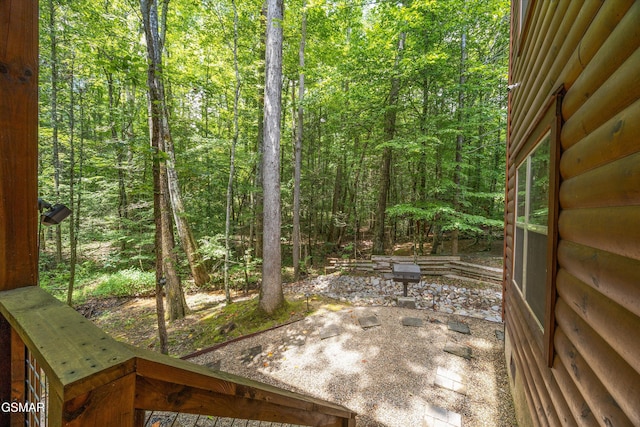 2313 Bogle Spring Loop, Sevierville, TN 37862 - view of yard featuring a patio area and a wooded view