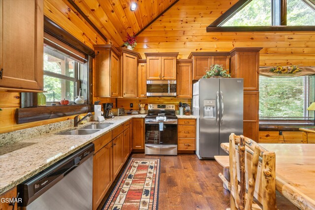 2313 Bogle Spring Loop, Sevierville, TN 37862 - kitchen with appliances with stainless steel finishes, vaulted ceiling, brown cabinets, dark wood-type flooring, and wooden ceiling