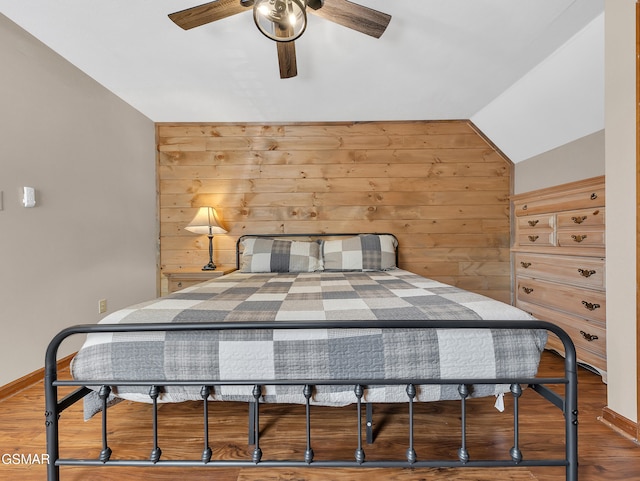2733 Timber Way, Pigeon Forge, TN 37863 - bedroom featuring wood walls, wood finished floors, vaulted ceiling, and baseboards