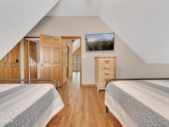 2733 Timber Way, Pigeon Forge, TN 37863 - bedroom featuring vaulted ceiling, light wood finished floors, and baseboards