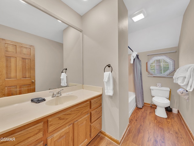 2733 Timber Way, Pigeon Forge, TN 37863 - full bathroom featuring toilet, wood finished floors, vanity, shower / tub combo with curtain, and baseboards