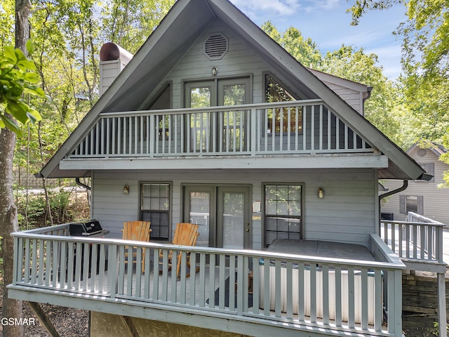 2733 Timber Way, Pigeon Forge, TN 37863 - rear view of house with a balcony, a chimney, and french doors