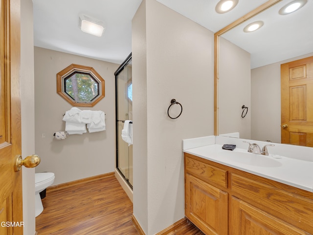 2733 Timber Way, Pigeon Forge, TN 37863 - bathroom with toilet, a shower stall, wood finished floors, vanity, and baseboards
