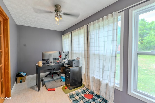 home office with baseboards and ceiling fan