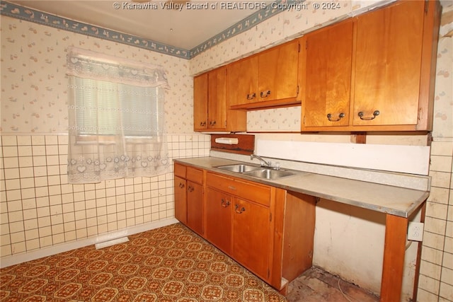 kitchen with tile walls and sink