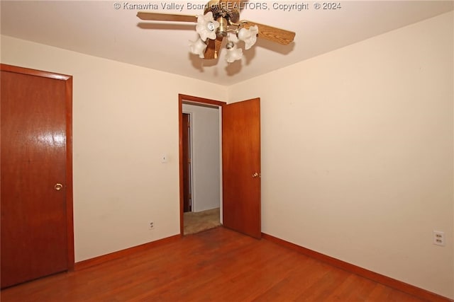 empty room featuring wood-type flooring and ceiling fan