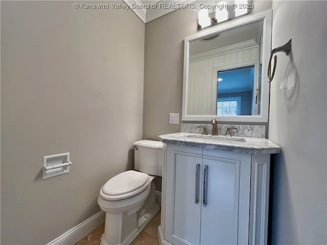 bathroom featuring tile floors, oversized vanity, and toilet