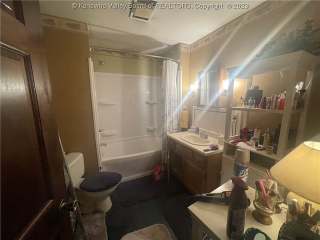 full bathroom featuring vanity, backsplash, shower / bath combo, and toilet