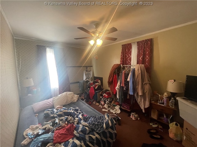 bedroom featuring ceiling fan and ornamental molding