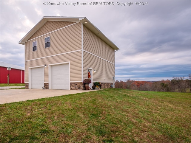 view of home's exterior featuring a garage and a lawn